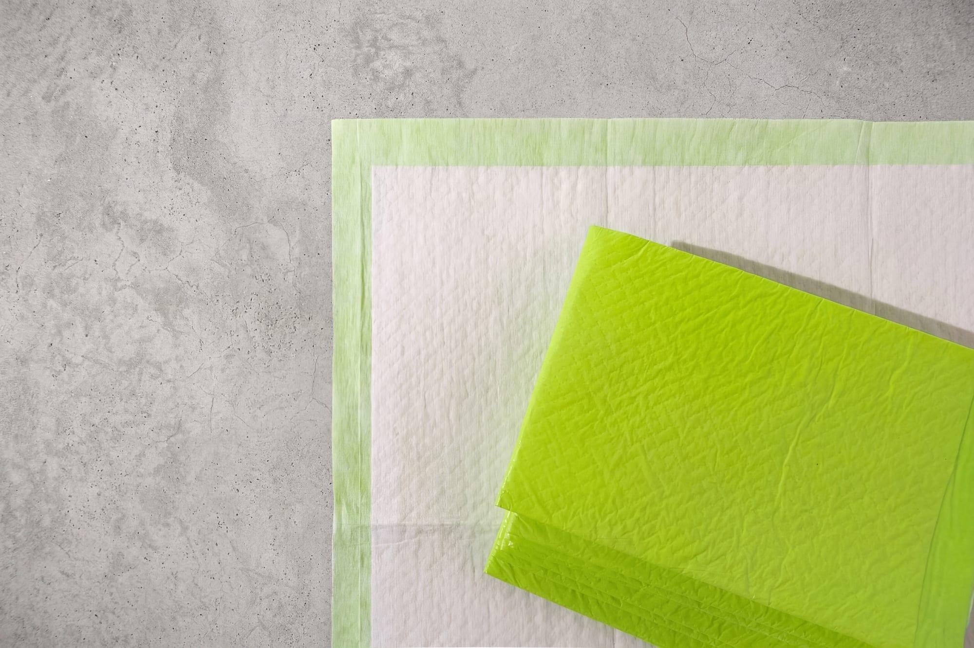 The six-layer Pee Pad held flat by the FloorMate, absorbing edge to edge