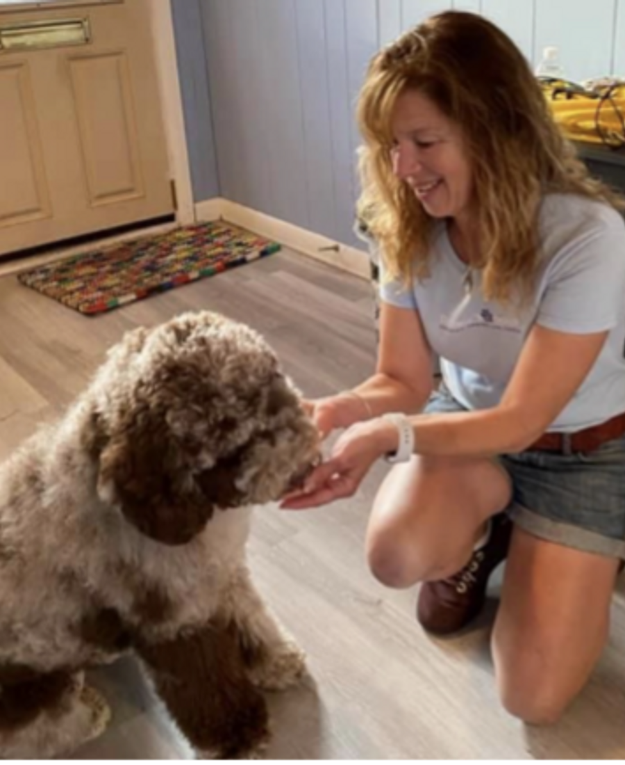 Debbie Sheridan giving a dog a treat